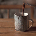 Hot chocolate being poured into a mug