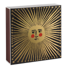 Decorative box with sun design and face illustration on a black background