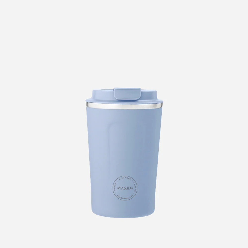 Light blue tumbler with a white rim on a white background