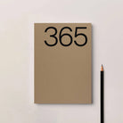Kinshipped Brown planner lifestyle flat lay