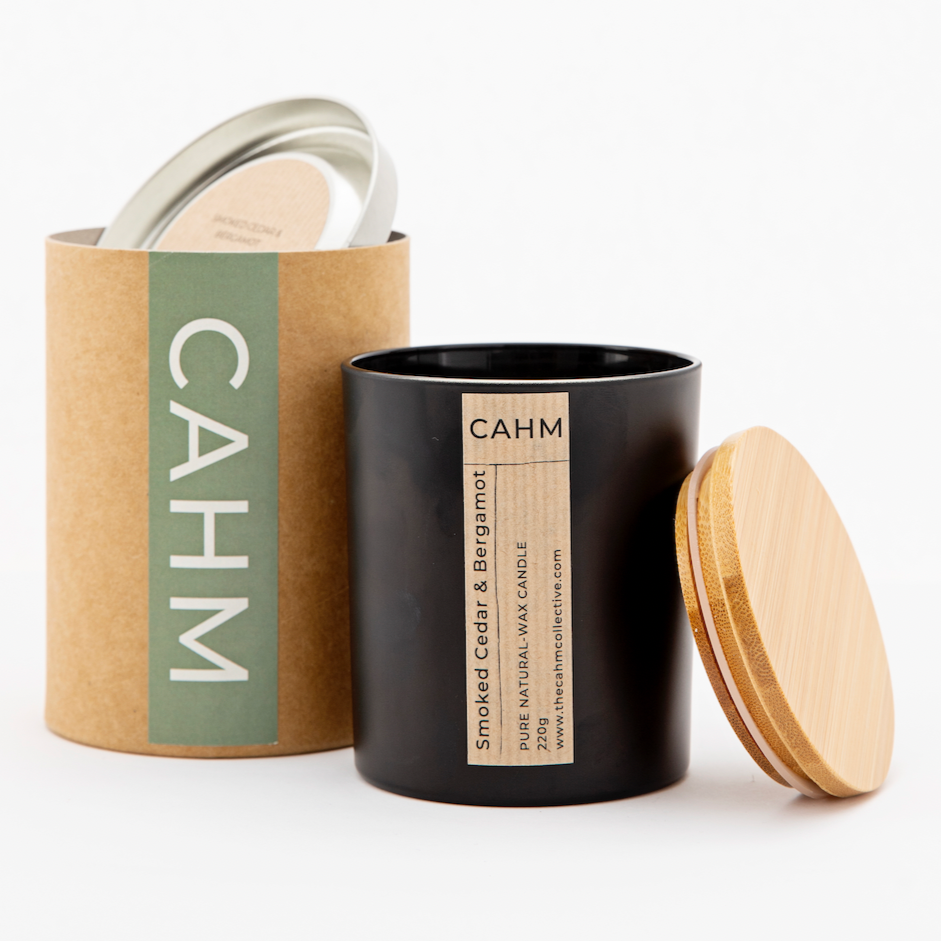 A Smoked Cedar and Bergamot Candle from the Black Glass Candle collection by The CAHM Collective.